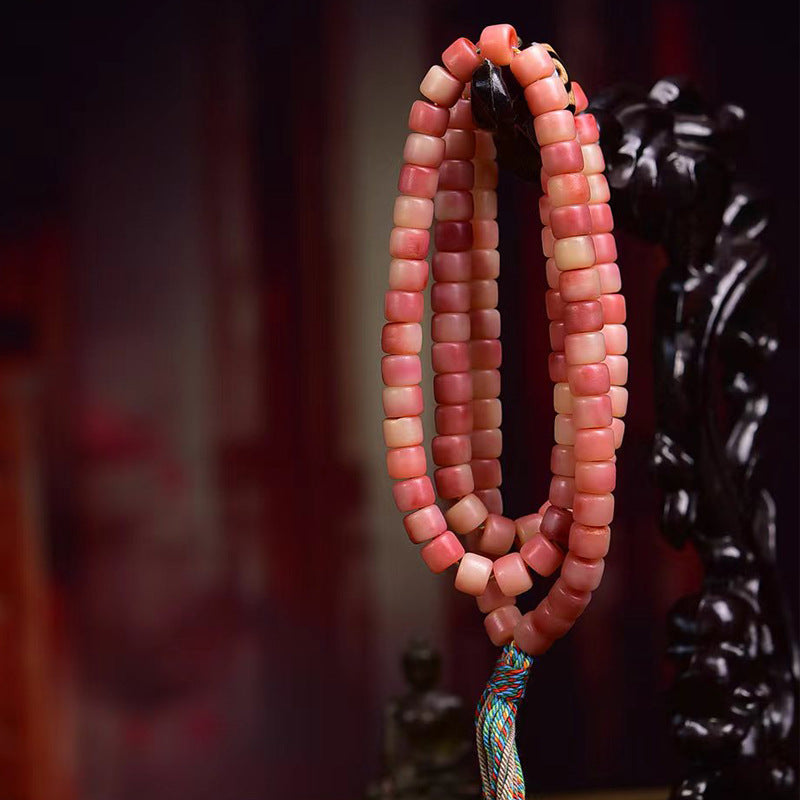 Handmade natural camel bone mala bracelet 108 beads on neutral background