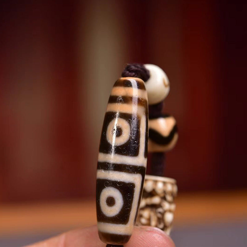 Tibetan four-eyes dzi and Zambala pendant wealth protection amulet