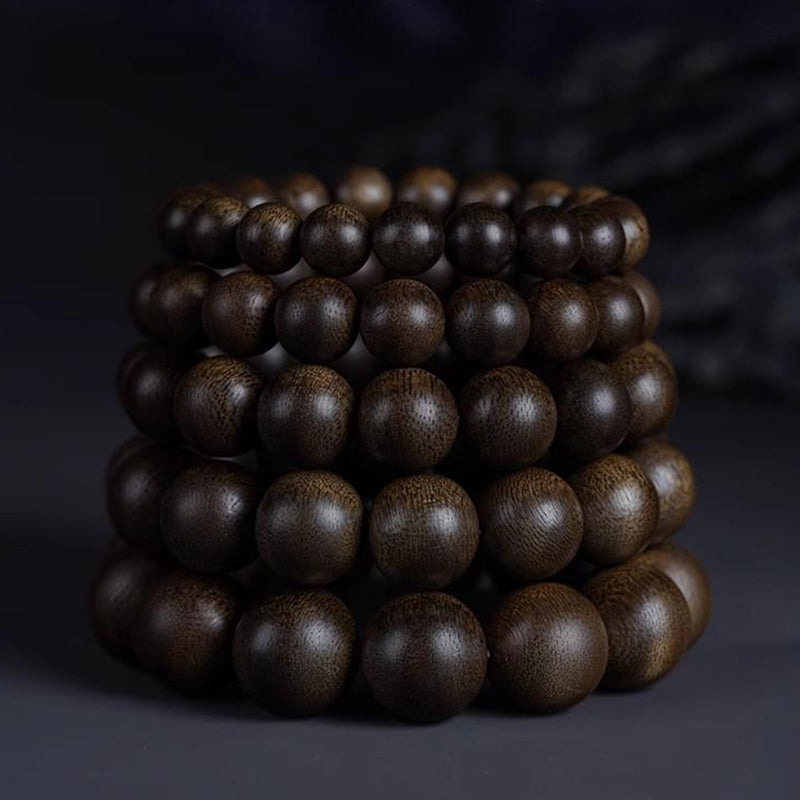 Premium agarwood mala 108 beads, handcrafted oud wood prayer beads on neutral background