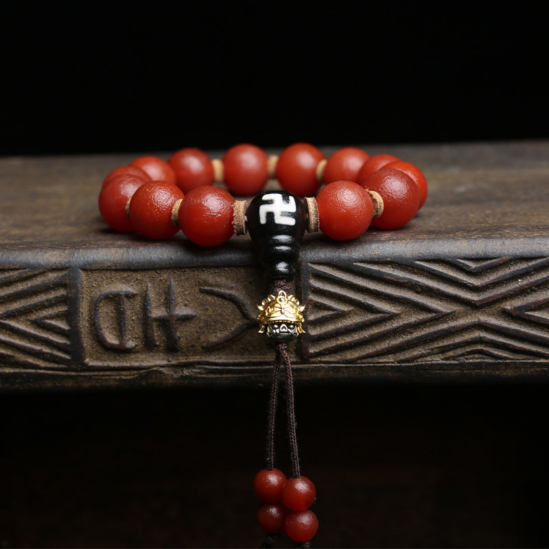 Red agate single wrap bracelet stacked with black obsidian bracelet for grounding and protection