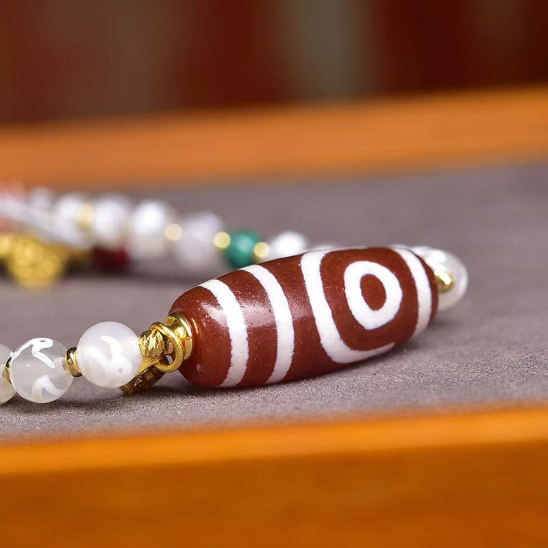 Close up of Tibetan Dzi bead surface with natural agate texture