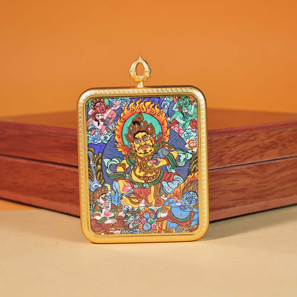 Close-up of hand-painted Yellow Jambhala miniature thangka showing gold details